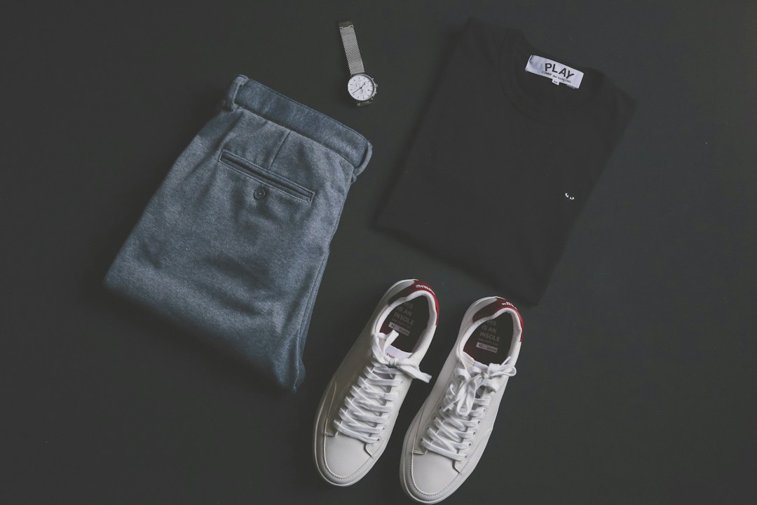Men's casual outfit pieces arranged together, illustrating polo and chinos styling